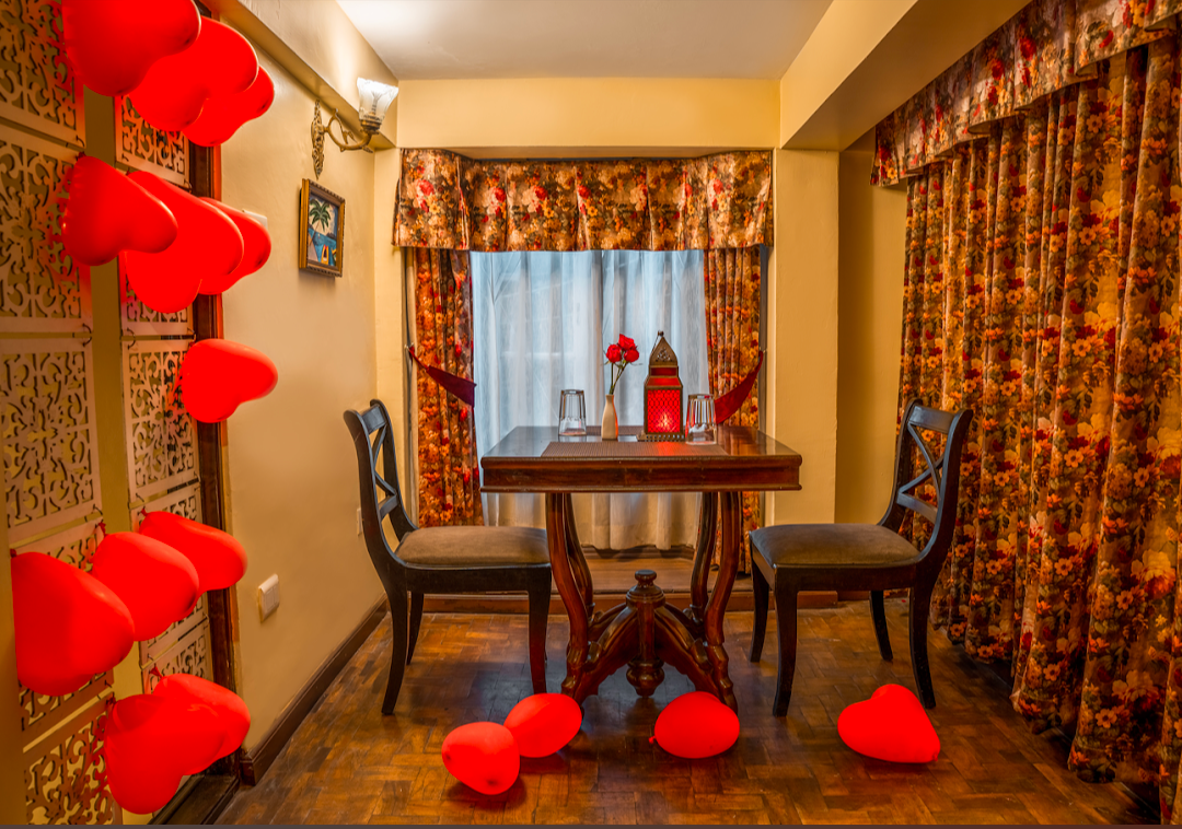 Summit Oakden Resort — romantic dining room with red heart décor