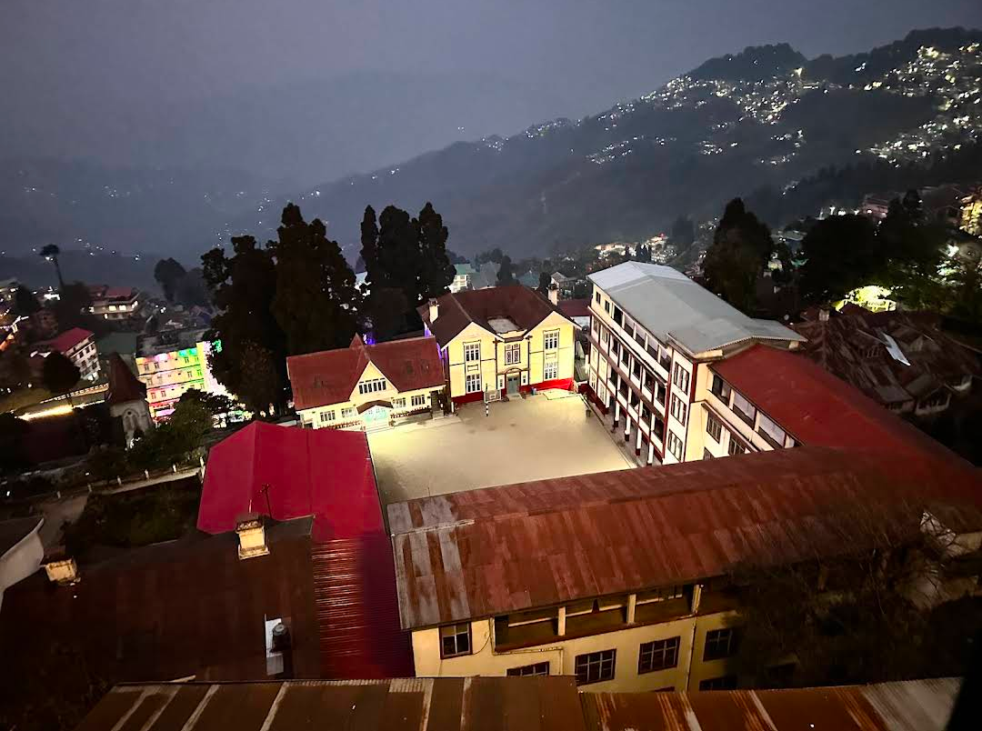 Summit Swiss Heritage Resort — Darjeeling hillside night panorama